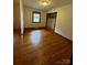 Hardwood flooring and neutral paint can be found in this bedroom with a window and closet at 5068 King Wilkinson Rd, Denver, NC 28037