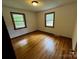Cozy bedroom with hardwood floors and ample natural light, creating a welcoming space at 5068 King Wilkinson Rd, Denver, NC 28037