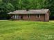 Charming brick ranch home on a large lot with mature trees and well-maintained lawn at 5068 King Wilkinson Rd, Denver, NC 28037