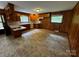 A kitchen with wooden cabinets, laminate countertop, and laminate floor at 5068 King Wilkinson Rd, Denver, NC 28037