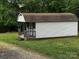 Exterior view of small, white outbuilding at 5068 King Wilkinson Rd, Denver, NC 28037