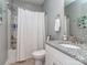 This bathroom features a tub and shower combination and a granite countertop sink and vanity at 5130 Mount Clare Ln, Charlotte, NC 28210