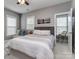 Cozy bedroom with abundant natural light, a comfortable bed, and modern decor at 5130 Mount Clare Ln, Charlotte, NC 28210
