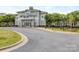 Beautiful clubhouse with meticulously manicured landscaping and a circular drive in a Primary-planned community at 5130 Mount Clare Ln, Charlotte, NC 28210