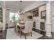 Cozy dining room with a wooden table, elegant chandelier, and built-in cabinet at 5130 Mount Clare Ln, Charlotte, NC 28210