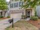 Attractive home exterior features a stone facade, manicured landscaping, and a welcoming front porch at 5130 Mount Clare Ln, Charlotte, NC 28210
