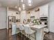 Modern kitchen with white cabinets, stainless steel appliances, marble countertops, and stylish bar stools at 5130 Mount Clare Ln, Charlotte, NC 28210