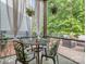 Relaxing screened-in patio area with comfortable seating and view of backyard at 5130 Mount Clare Ln, Charlotte, NC 28210