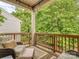 Inviting porch area with comfortable seating and views of lush greenery at 5130 Mount Clare Ln, Charlotte, NC 28210