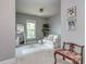Cozy sitting room features plush seating, bright natural light, and calming gray paint at 5130 Mount Clare Ln, Charlotte, NC 28210