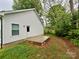 View of backyard showcasing a small patio and white siding on the home at 514 Rich St, Rock Hill, SC 29730