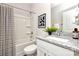 Bathroom with a granite countertop vanity, shower-tub, and contemporary decor at 514 Rich St, Rock Hill, SC 29730