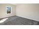 Cozy carpeted bedroom with a bright window offering outdoor views at 514 Rich St, Rock Hill, SC 29730