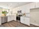 Well-lit kitchen with sleek stainless steel appliances, white cabinetry, and stylish backsplash at 514 Rich St, Rock Hill, SC 29730