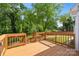 Spacious wood deck with railings that offers a view of the backyard at 514 W Sumter St, Shelby, NC 28150