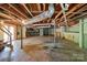 Exposed basement with utilities and stairs to upper floors. Large open space at 514 W Sumter St, Shelby, NC 28150