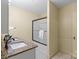 Neutral bathroom showcases a vanity with a granite top, a single sink, and a glass shower at 514 W Sumter St, Shelby, NC 28150