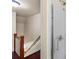 Bathroom next to the stairs featuring a shower with sliding glass door and silver fixtures at 514 W Sumter St, Shelby, NC 28150