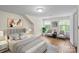 Staged bedroom features hardwood floors, neutral colors, and ample natural light at 514 W Sumter St, Shelby, NC 28150