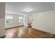 Bedroom with hardwood floors, neutral walls, and natural light from windows at 514 W Sumter St, Shelby, NC 28150