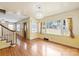 Sunlit dining area with hardwood floors and modern light fixture at 514 W Sumter St, Shelby, NC 28150