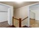 Hallway featuring hardwood floors and stairs leading to the upper level at 514 W Sumter St, Shelby, NC 28150