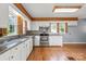 Updated kitchen with stainless steel appliances, ample counter space, and wooden beam accents at 514 W Sumter St, Shelby, NC 28150