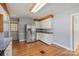 Kitchen with stainless steel appliances, lots of cabinets, wooden floor, and granite countertops at 514 W Sumter St, Shelby, NC 28150