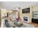 Cozy living room featuring a fireplace, hardwood floors, and natural light at 514 W Sumter St, Shelby, NC 28150