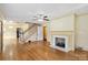 Bright living room featuring hardwood floors and a classic fireplace at 514 W Sumter St, Shelby, NC 28150