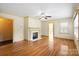 Hardwood floored living room, featuring a fireplace and neutral paint tones at 514 W Sumter St, Shelby, NC 28150