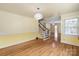 Spacious living room with hardwood floors, staircase, and ample natural light at 514 W Sumter St, Shelby, NC 28150