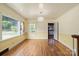 Bright living room with hardwood floors, large windows, and neutral paint scheme at 514 W Sumter St, Shelby, NC 28150