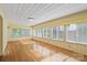 Light-filled sunroom featuring hardwood floors and large windows offering natural light at 514 W Sumter St, Shelby, NC 28150