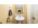 Powder room features a pedestal sink and modern fixtures with a neutral color palette at 518 Dutch White Dr, Clover, SC 29710