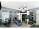 Cozy bedroom with a lofted bed, desk, lounge area, and ceiling fan at 518 Dutch White Dr, Clover, SC 29710