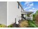 Home exterior featuring a covered porch, backyard, and well-maintained landscaping at 518 Dutch White Dr, Clover, SC 29710