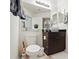 Bathroom featuring modern vanity, basin sink, large mirror, and neutral decor at 529 N Graham St # 3F, Charlotte, NC 28202