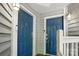 Double, solid, blue entry doors offering a welcoming entrance to a well-maintained condo unit at 529 N Graham St # 3F, Charlotte, NC 28202