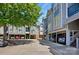 A row of townhomes showcases neat covered parking, and an attractive exterior at 529 N Graham St # 3F, Charlotte, NC 28202