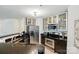 Modern kitchen featuring stainless steel appliances, sleek countertops, and ample cabinet space for convenience at 529 N Graham St, Charlotte, NC 28202