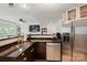 Modern kitchen with stainless steel appliances, granite countertops, and an island at 529 N Graham St # 3F, Charlotte, NC 28202