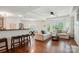 Open-concept living room with lots of natural light, hardwood floors, and neutral decor for relaxation at 529 N Graham St # 3F, Charlotte, NC 28202