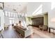 Spacious living room with high ceilings, many windows, modern furniture, and hardwood floors at 529 N Graham St # 3F, Charlotte, NC 28202