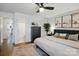 Bedroom with neutral decor, hard wood floors, and ensuite bathroom entrance at 529 N Graham St # 3F, Charlotte, NC 28202