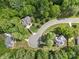An aerial view of a neighborhood showcasing the arrangement of houses and surrounding greenery at 5617 Sugarcane Ct, Mint Hill, NC 28227