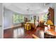 Spacious bedroom features hardwood floors, a ceiling fan and windows allowing for natural light to come in at 5617 Sugarcane Ct, Mint Hill, NC 28227