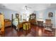 Lovely bedroom boasts hardwood floors, a ceiling fan and matching wood furnishings at 5617 Sugarcane Ct, Mint Hill, NC 28227