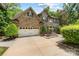 Exterior of a two-story brick home with manicured lawn, driveway and attached garage at 5617 Sugarcane Ct, Mint Hill, NC 28227