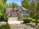 Charming brick home with a two-car garage, basketball hoop, and a well-manicured front yard at 5617 Sugarcane Ct, Mint Hill, NC 28227